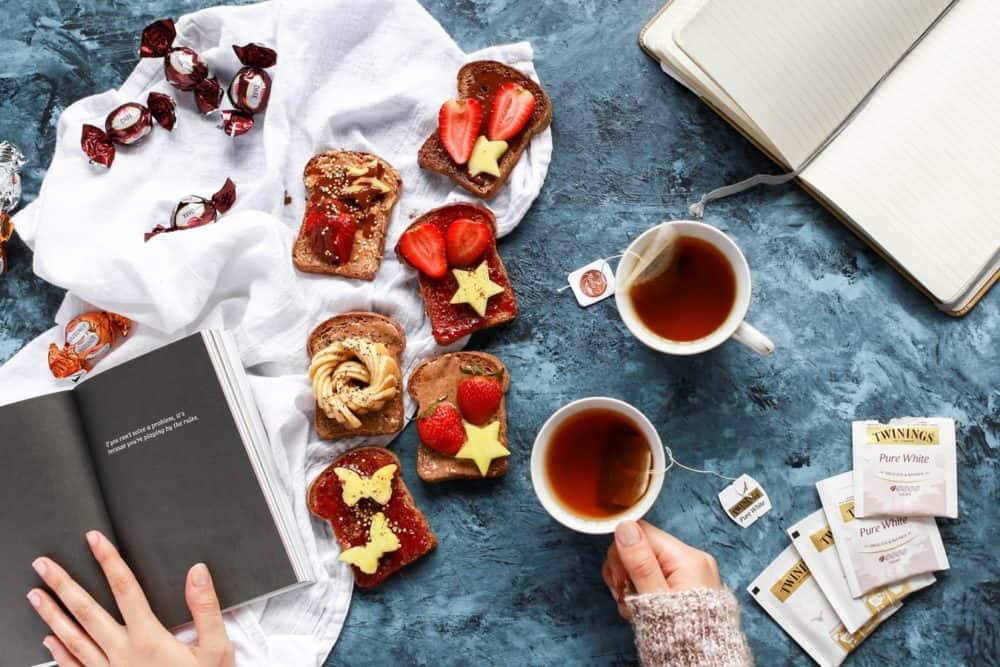 tea and snacks spread out on table