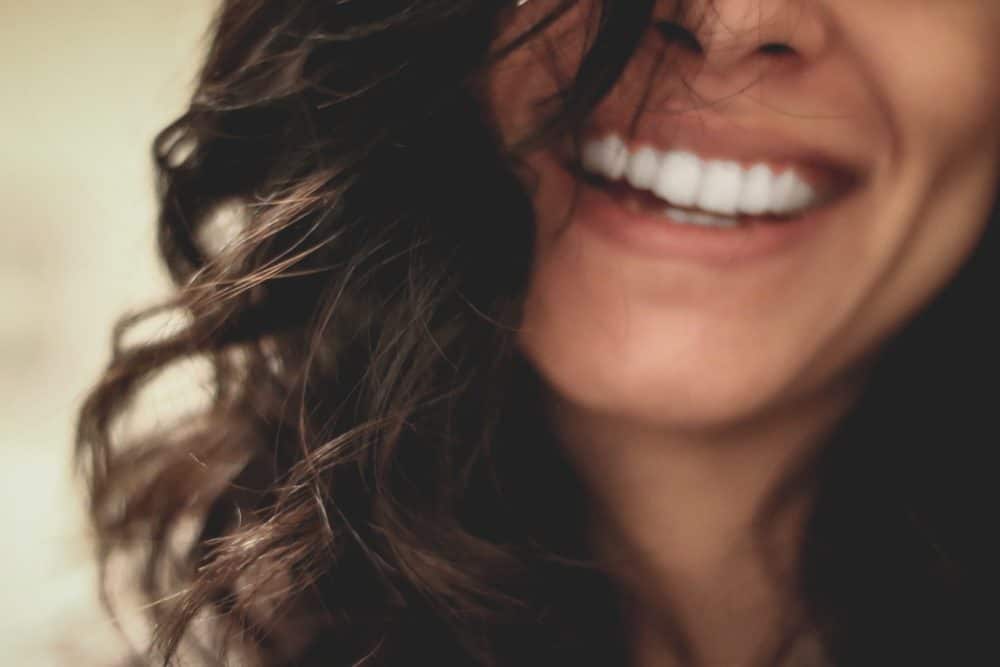 woman with dark hair smiling
